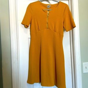 ASOS mini dress with a half zip down front and round collar. Mustard yellow.